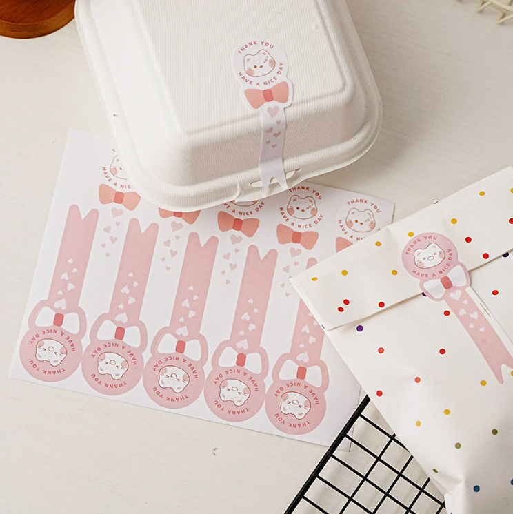 สติ๊กเกอร์ Thank you กระดาษเคลือบกันน้ำ (ระดับแช่ตู้เย็น) ขนาด 3x10 cm. 10 ดวง/แผ่น แพ็ค 10 แผ่น (100 ดวง)