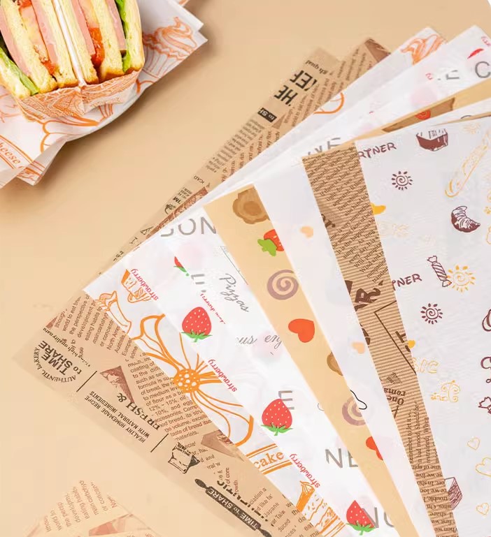กระดาษไขรองอาหาร (Greaseproof paper) เคลือบกันน้ำ-น้ำมัน ขนาด 28x38 ซม. แบบแพ็ค 100 ชิ้น